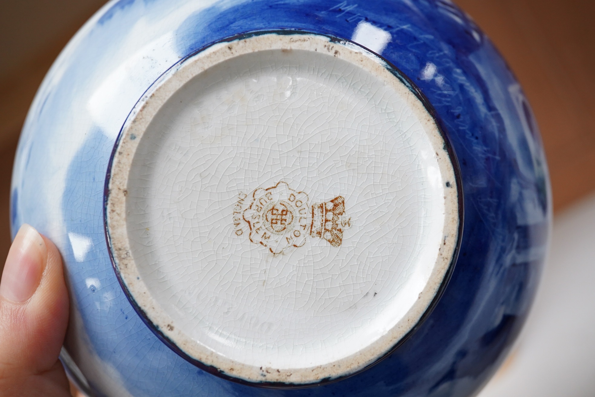 A Doulton Burslem Mount Edgecumbe, Plymouth blue and white signed vase, 14.5cm high. Condition - top rim broken